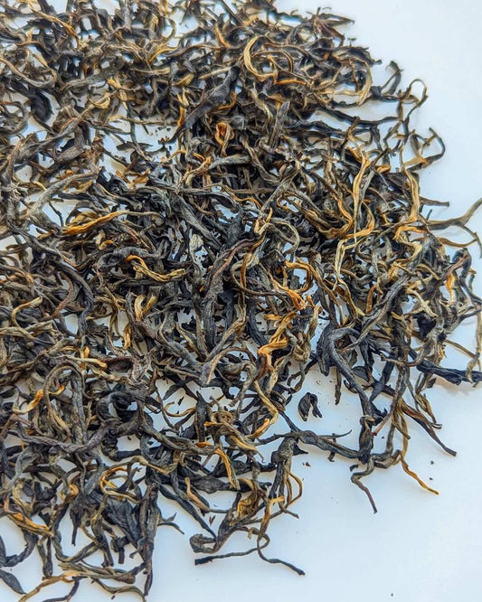 P-126 Clonal Tippy Reserve Organic Black Tea loose leaves, showcasing premium organic quality and handcrafted excellence.