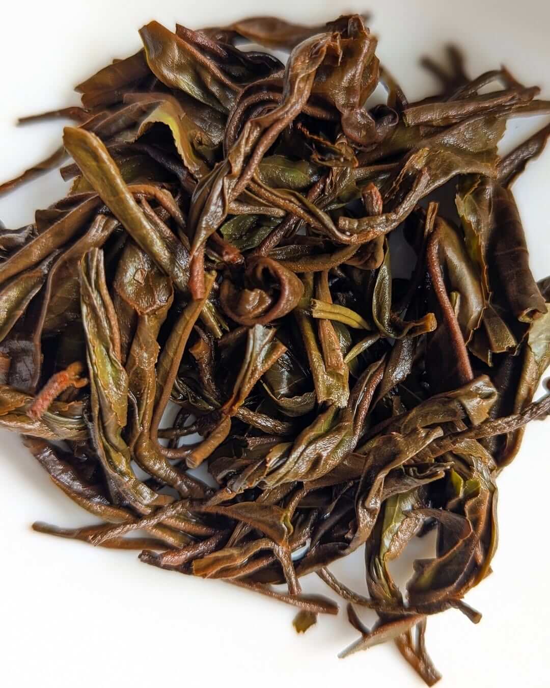 Loose leaf organic black tea leaves from the P-126 Clonal Tippy Reserve, showcasing premium quality and craftsmanship.